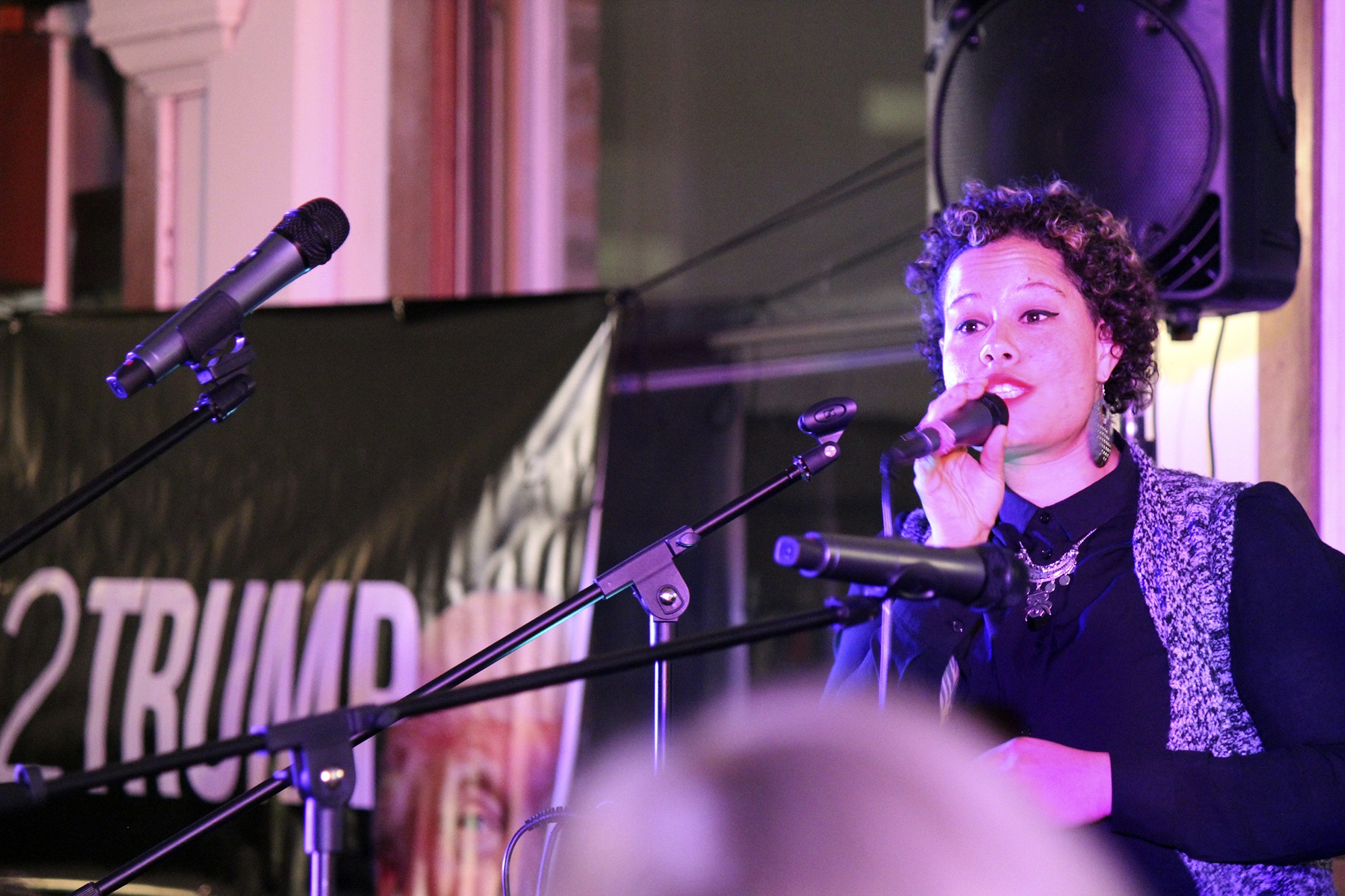 Local activist and artist Nikkita Oliver sings at the #Earth2Trump event in Seattle. Photo by Sara Bernard.