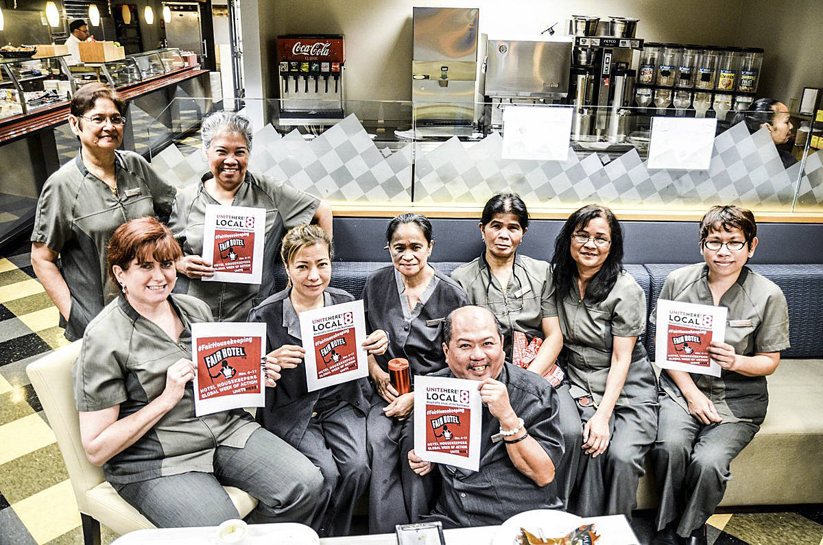 Westin Hotel workers hold up signs in support of housekeepers’ rights. Photo by Hannah Long-Higgins