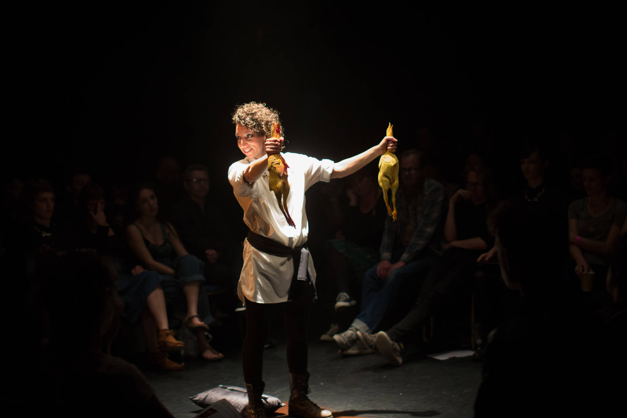 Rachel Mars chokes the chickens in ‘Our Carnal Hearts’ at On the Boards. Photo by Claire Haigh