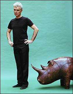 David Byrne is about to turn around and take the sculpted rhino by the horn.