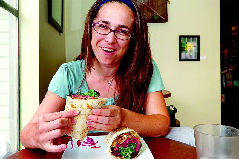 Mary King with her “Sweet Jamaican” sandwich, which contains absolutely no jerk chicken.