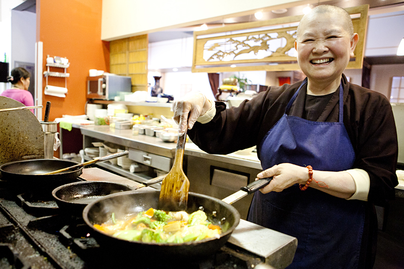 Buddhist nun Hue Phan at the stove of eternal vegetation. View the slide show here.