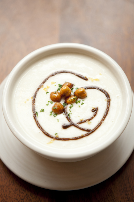 A cauliflower soup, scribbled with a brawny black olive vinaigrette, was thicker than its vegan profile would suggest. But like a gangster pummeling a rival who refuses to give up information, the kitchen had smacked the soup with so much salt in hopes of extracting flavor that it ultimately incapacitated the vulnerable vegetable.