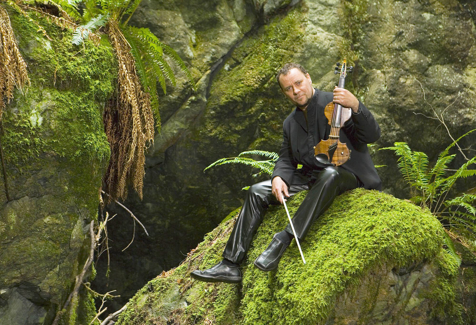 Portraits of Geoffery Castle playing the Violin