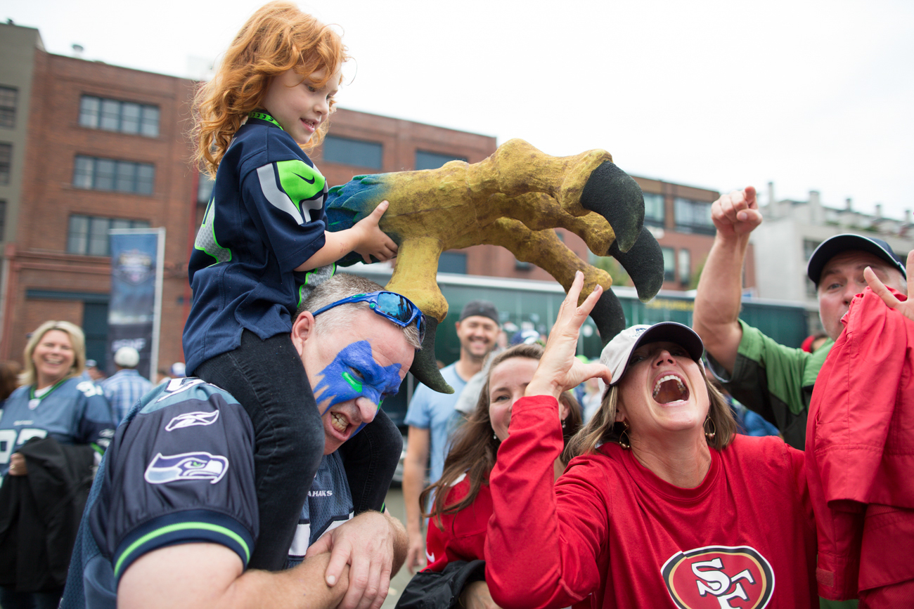 49ers fan Jenette Yearsley is sea-clawed by Hanah Meyers and her father Rob Cockerill before the game.