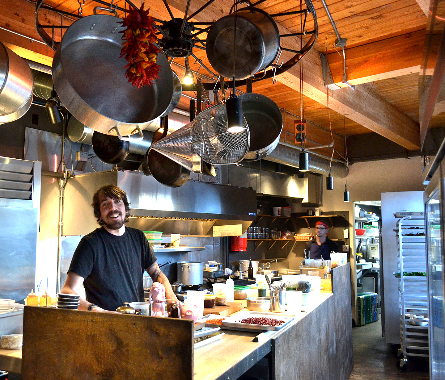 Ronspies in his cozy kitchen at Le Petit Cochon.