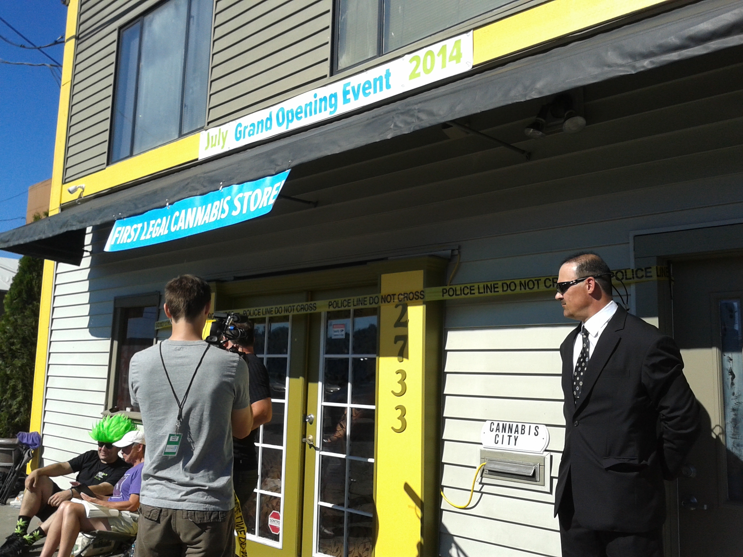 Body guard Dan Webber looks on as media shoot opening day at Cannabis Cityphoto by Nina Shapiro