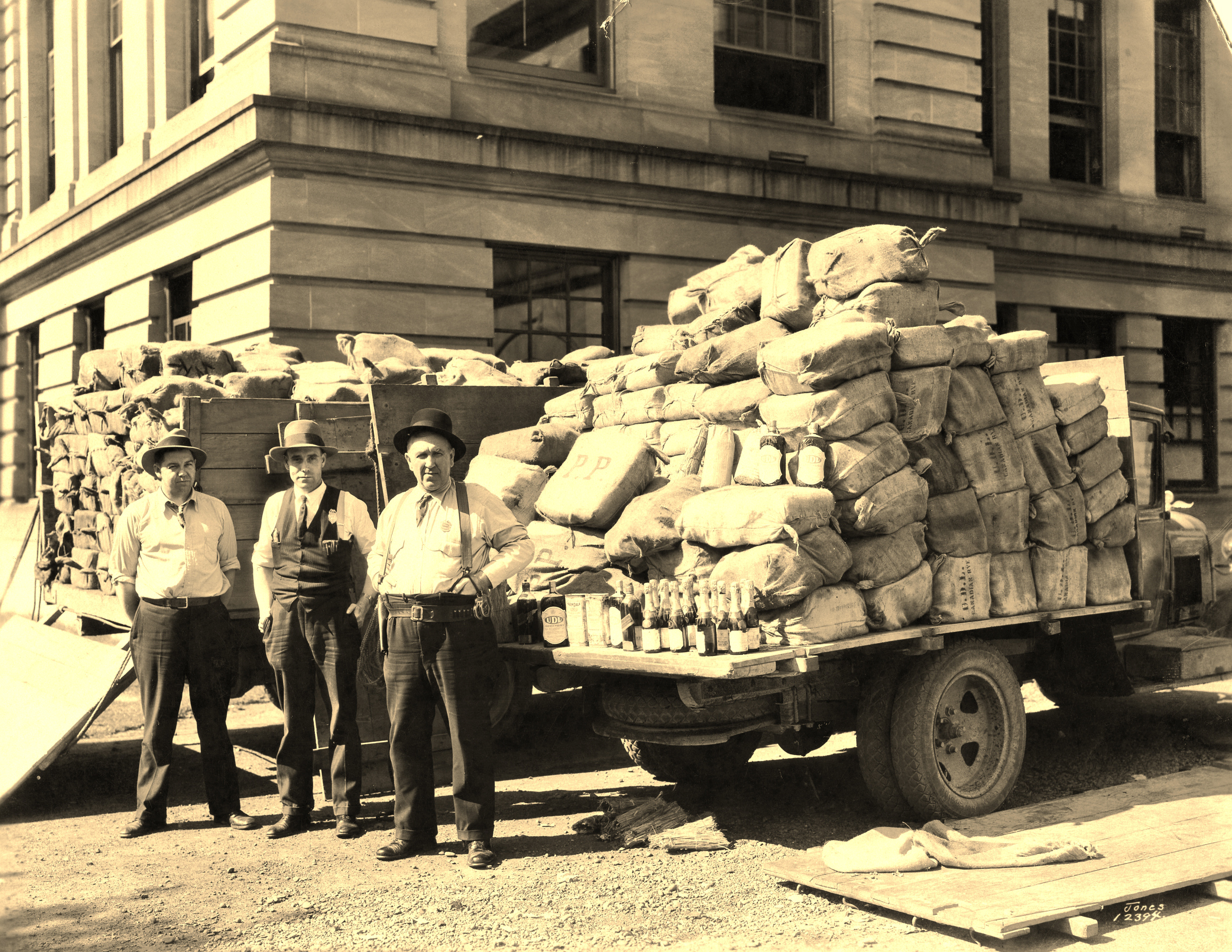 Photo courtesy Karl DavidsonDeputy Carlton Stearns (center) and Sheriff Jeff Bartell (R) after Stearns busted a large cache of illegal liquor; June 20, 1931, from Jan's original