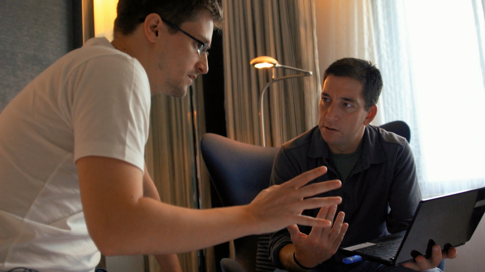 Snowden (left) asks Greenwald's help in framing his story. Radius/TWC