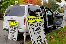 Installing fixed cameras to enforce school zone speed limits of 20 mph