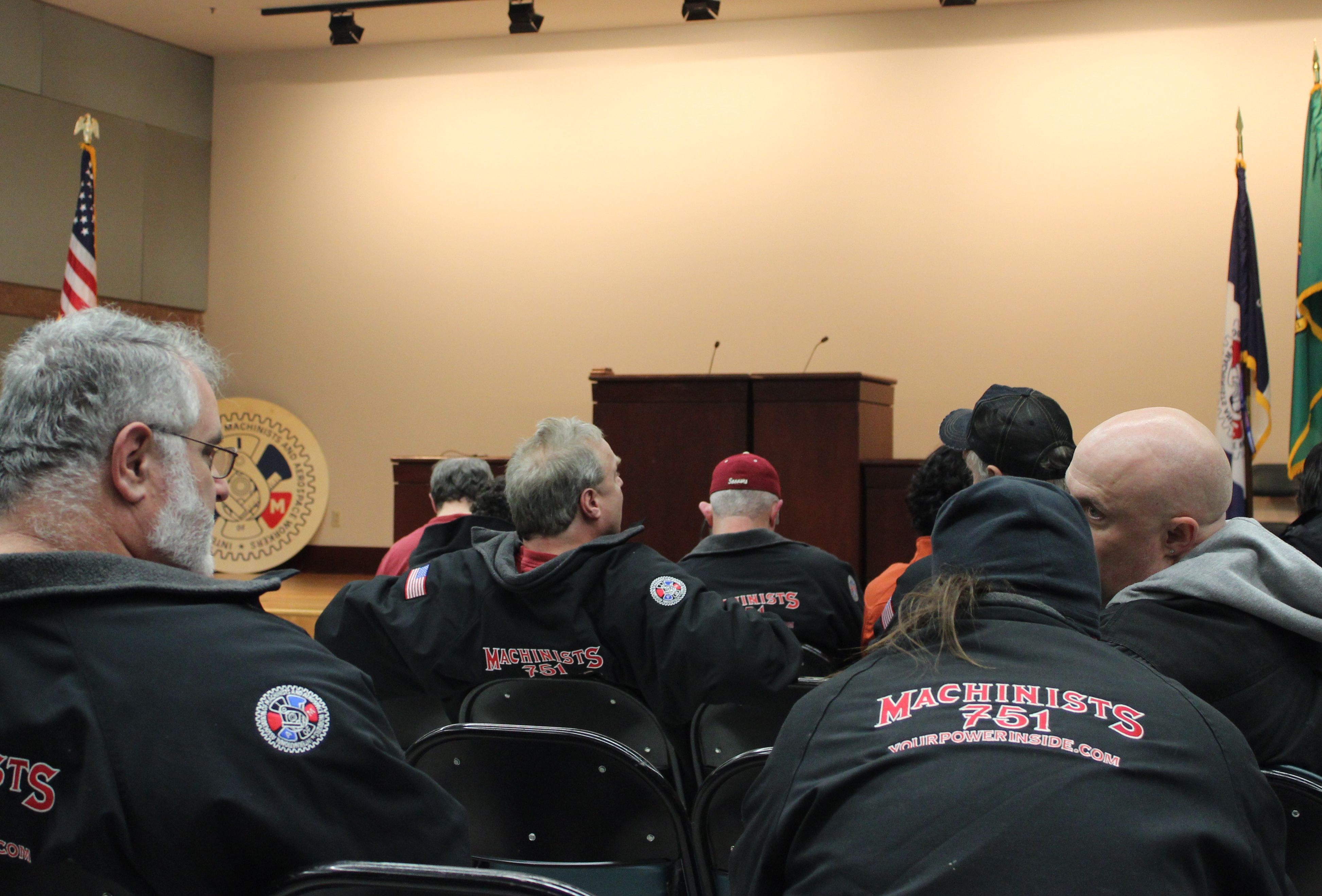 Boeing machinists wait for the tally.