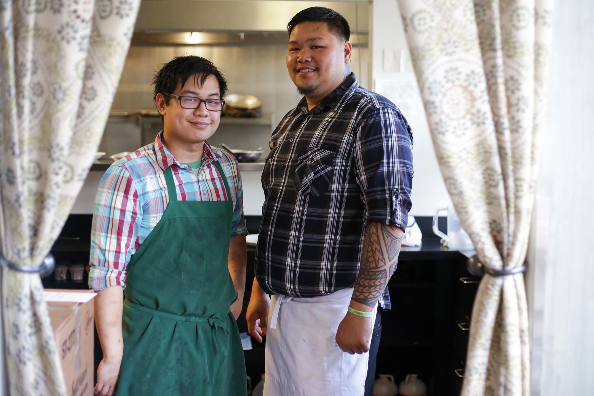 Irbille Donia, right, with his friend and fellow Filipino cook, Justin Legaspi. Photo by Joshua Bessex